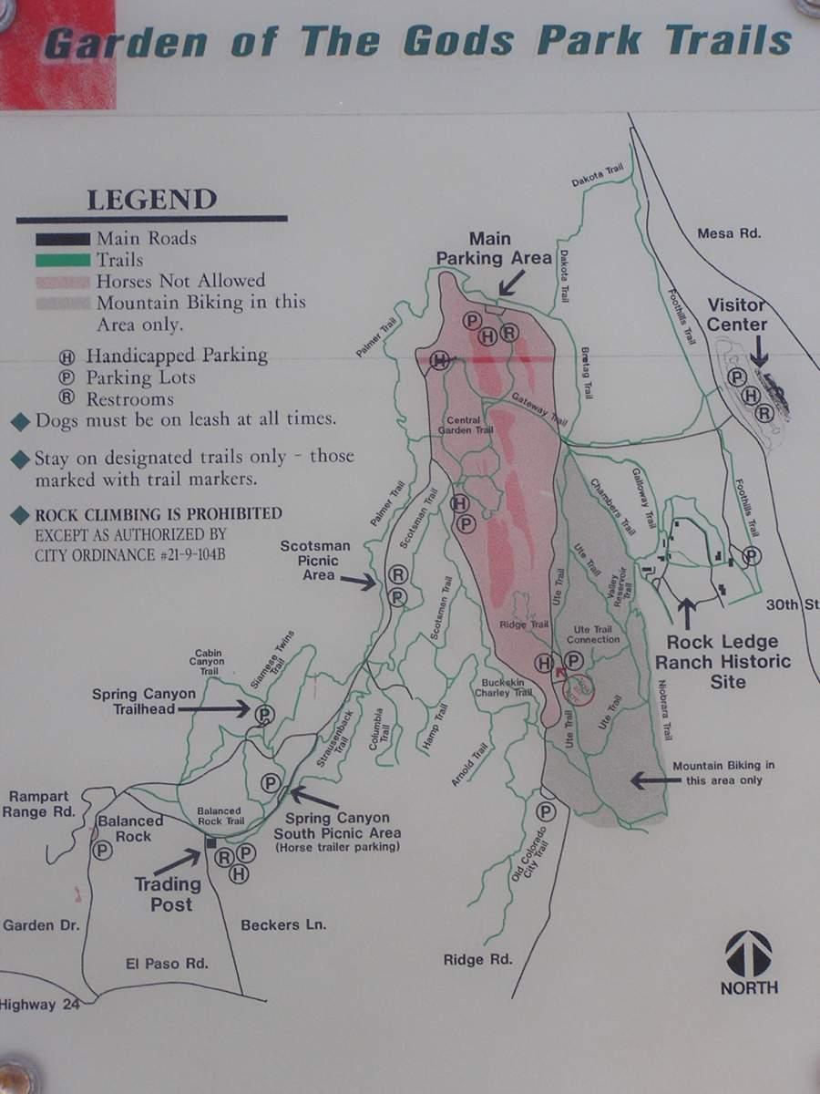 Map of the Garden of the Gods Park, featuring trails, parking areas, and points of interest. Includes a legend indicating main roads, trails, restricted activities, and rules for dog walking and rock climbing. The map highlights various trailheads, picnic areas, and other features in the park. Garden of the Gods: Ute Trail mountain bike trail.
