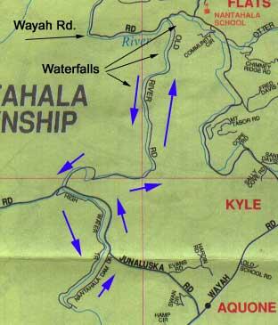 A map of the Tuckasegee River area, highlighting roads and locations such as Wayah Road, waterfalls, and the surrounding regions of Junaluska, Kyle, and Aquone, marked with arrows. Old River Road mountain bike trail.