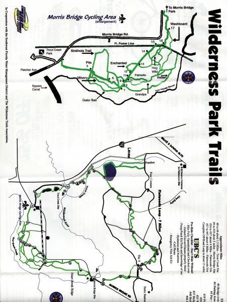Map of Wilderness Park Trails featuring cycling routes and paths, with key landmarks such as Morris Bridge Park, Sinkhole Trail, and various trail intersections. The map includes a layout of both biking and walking trails, marked in green, and highlights points of interest within the park. Morris Bridge Park mountain bike trail.