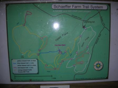 Map of the Schaeffer Farm Trail System, showing various trails marked in different colors, a parking lot, and open fields. The map indicates distances for each trail and includes a legend for reference. Schaeffer Farms mountain bike trail.