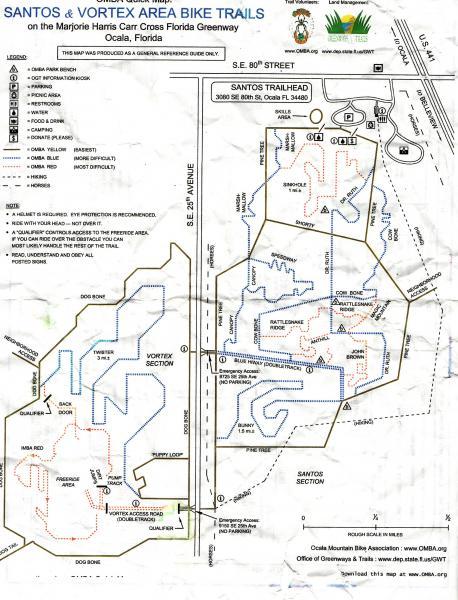 Map of the Santos and Vortex Area Bike Trails located on the Marjorie Harris Carr Cross Florida Greenway in Ocala, Florida. The map outlines various bike trails, including features like the Santos Trailhead, different trail sections, difficulty levels, and additional facilities such as picnic areas and camping spots. Santos mountain bike trail.