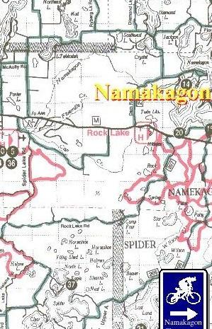 Detailed map of the Namakagon area, featuring Rock Lake and surrounding roads, trails, and landmarks. The map includes topographical lines, marked routes, and a legend indicating different features in the region. Glacier mountain bike trail.