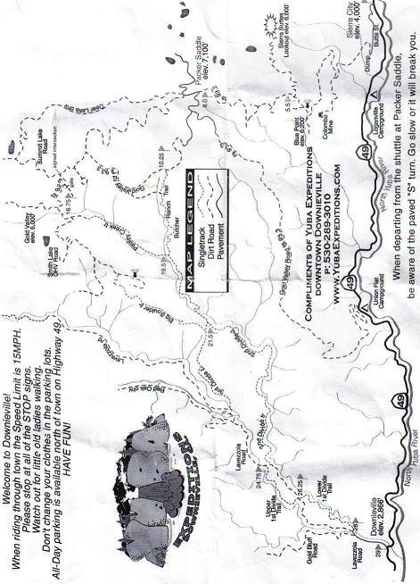 A black and white map featuring the area around Doniphan, with marked routes and landmarks. The map includes a legend for navigation, instructions for visitors, and promotional information for a local adventure company. Various trails and roads are depicted, indicating significant locations and points of interest in the region. Downieville Downhill mountain bike trail.