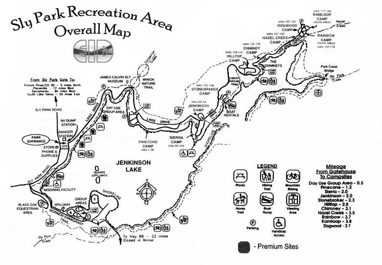 Overall map of Sly Park Recreation Area, featuring Jenkinson Lake and surrounding campsites. The map includes labeled areas for parking, picnic sites, hiking trails, and boat rentals, with a legend indicating different site types and their corresponding mileages from the gatehouse. Sly Park mountain bike trail.