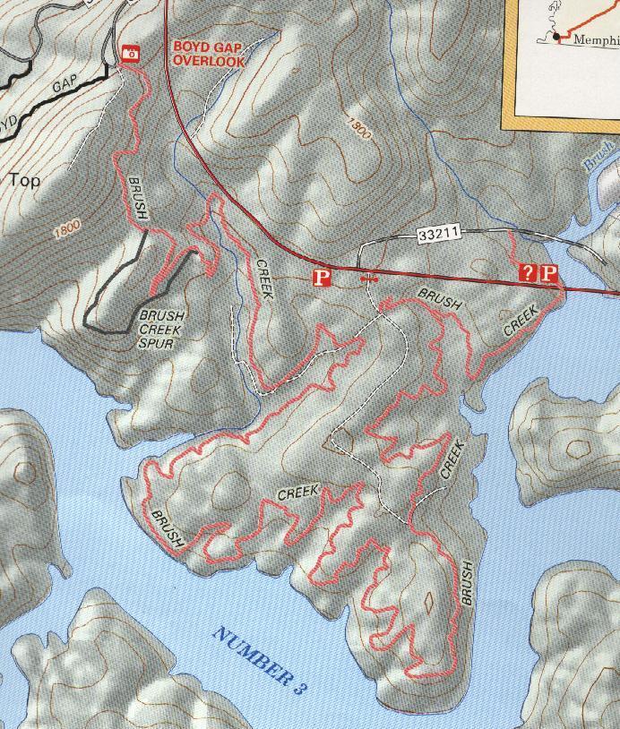 A topographic map depicting the Boyd Gap Overlook area, featuring contours, waterways labeled as Brush Creek and its tributaries, and various elevation markers. The map highlights trails and designated parking areas. Brush Creek mountain bike trail.