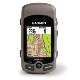 A Garmin Edge 605 GPS device displaying a map with speed and heading information, featuring a gray casing and a black screen with navigation details.