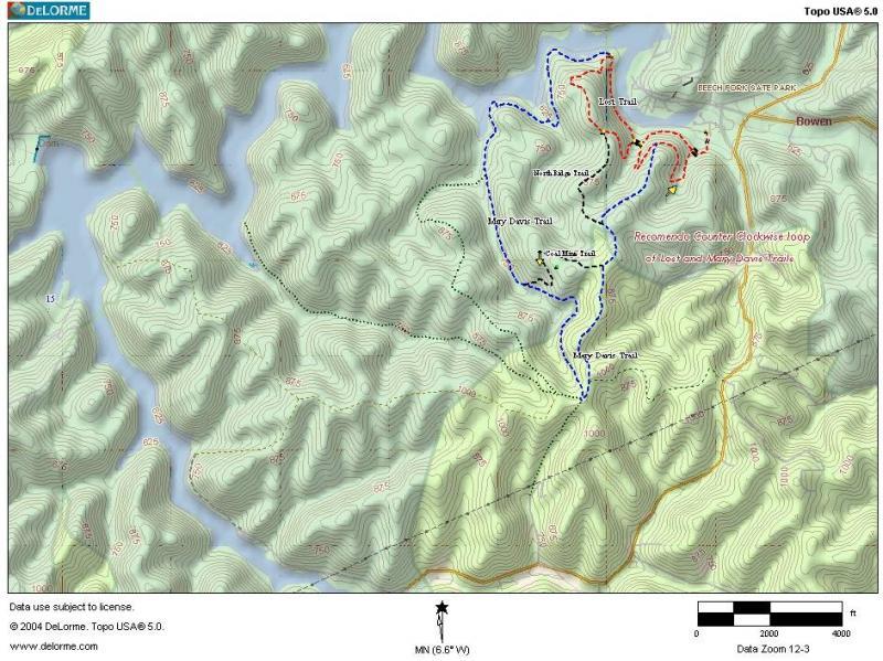 Topographic map showing the layout of various trails, including the Mary Davis Trail, North Hill Trail, and Lush Trail. The map features elevation contours and marked trail routes in blue and red. A scale bar and compass orientation are included, indicating the area around Bowen and surrounding hills. Data use and copyright information is also provided at the bottom. Beech Fork State Park mountain bike trail.