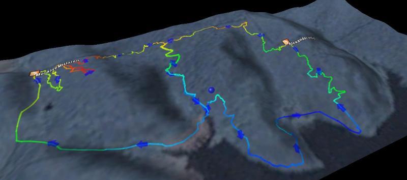 3D topographical map showing a winding trail with colorful routes indicated in blue, green, yellow, and red over a mountainous terrain. The paths represent different trails or routes in the area, with labeled waypoints for navigation. Moraine State Park mountain bike trail.