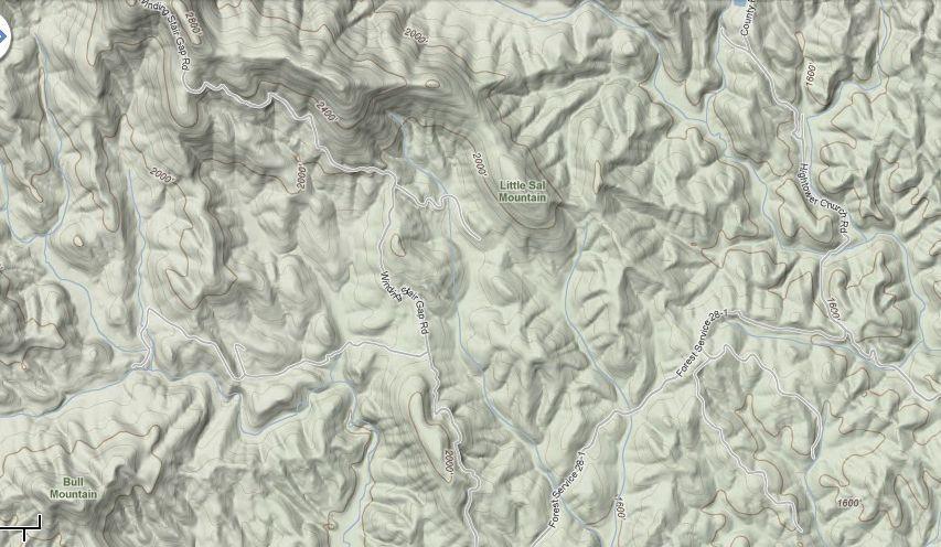 Topographic map showing the terrain of a mountainous region, featuring contour lines, various elevations, and labeled landmarks such as Little Sal Mountain and Bull Mountain. Several winding roads and pathways are also visible throughout the landscape. Bull / Jake Mountain mountain bike trail.