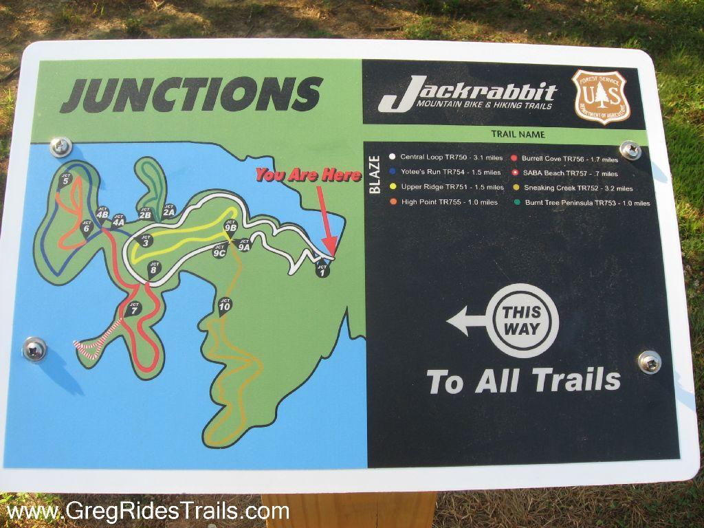 Map diagram indicating the junctions of the Jackrabbit Mountain Bike and Hiking Trails, with labeled trails, distances, and a "You Are Here" marker. Includes directional signage for navigating to all trails. Jack Rabbit Trails mountain bike trail.