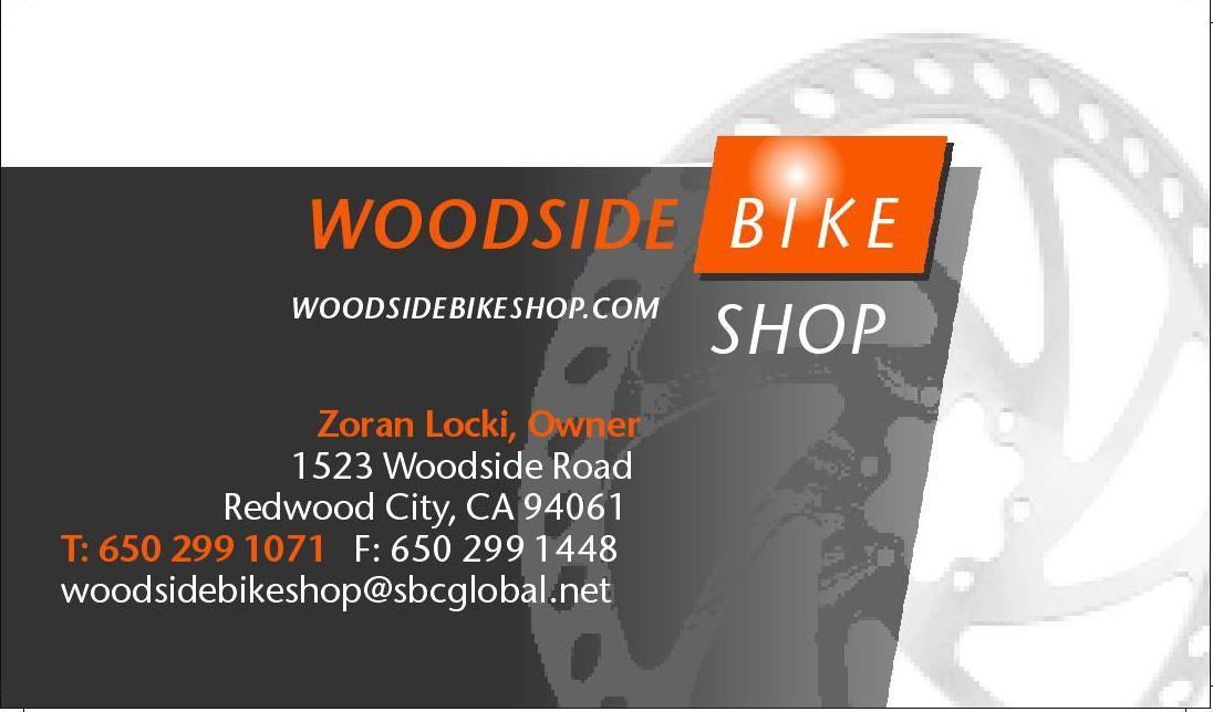 Alt text: Business card for Woodside Bike Shop, featuring the shop name and website, owner's name Zoran Locki, address at 1523 Woodside Road, Redwood City, CA 94061, contact numbers, and email. Background includes a bicycle component design.