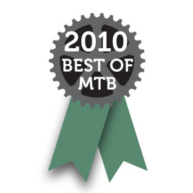 Graphic design featuring a circular gear symbol at the top with the text "2010" above and "BEST OF MTB" below, accompanied by two green ribbon tails.