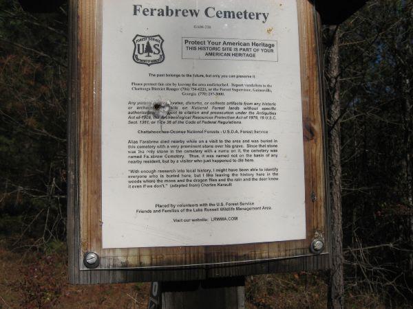A weathered sign at Ferabrew Cemetery, detailing preservation efforts and historical significance. The sign includes the U.S. Forest Service emblem and provides guidelines for protecting the site as part of American heritage. It mentions collaboration with local volunteer groups and encourages visitors to respect the cemetery's history. Latham Cemetary mountain bike trail.