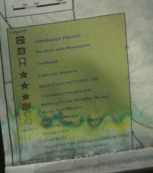 Map legend featuring various facilities and amenities, including an information pavilion, restrooms, exercise stations, a children's playground, and markers for walking routes and horse trails. Bonita Lakes mountain bike trail.