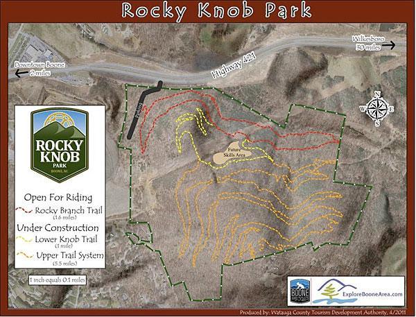 Map of Rocky Knob Park showing trail systems, including the Rocky Branch Trail (14 miles) and areas under construction. The map includes a scale, direction indicators, and information about the park's proximity to Downtown Boone and Highway 421. Rocky Knob Park mountain bike trail.