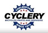 Logo of Chelmsford Cyclery, featuring the word "Cyclery" prominently, with "Bicycles Parts and Services" and "Since 1974" below it, surrounded by a blue gear design with stars.
