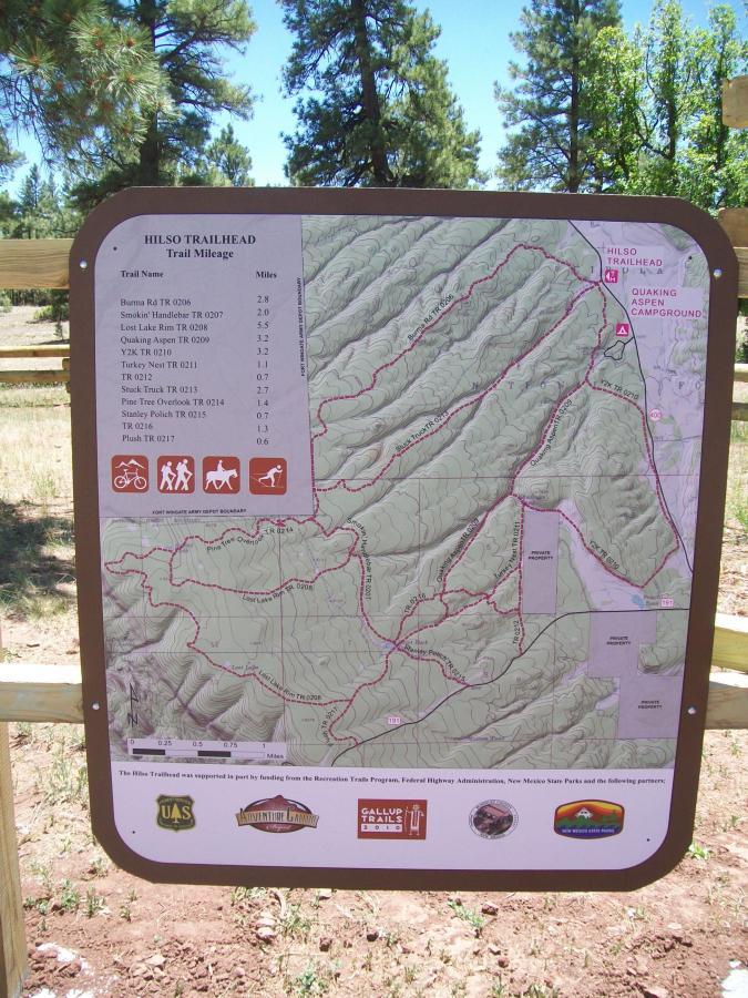 Map of the Hilso Trailhead, displaying various hiking trails, their names, and corresponding mileages. The map features topographical details with marked trails suitable for hiking, horseback riding, and biking, along with recognizable landmarks like Quaking Aspen Campground. Quaking Aspen Trail mountain bike trail.
