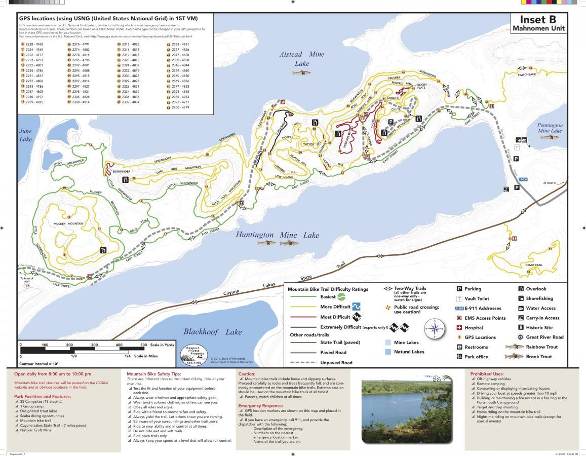 Map of Mahnomen Unit, illustrating GPS locations and mountain biking trails. Features include trail difficulty ratings, parking areas, restrooms, and emergency contact information. Lakes and surrounding trails are marked, along with safety and usage guidelines. The map includes a scale for distance reference. Cuyuna Lakes mountain bike trail.