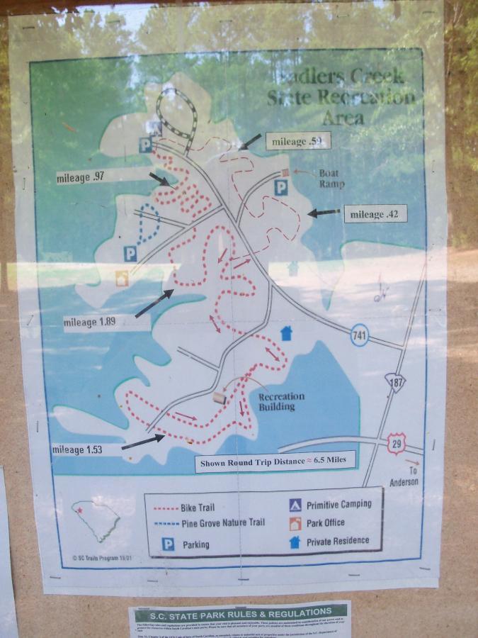 Map of Edisto Creek State Recreation Area showing trails, mileage markers, parking locations, and key facilities such as the boat ramp and park office. The map indicates a total round-trip distance of approximately 6.5 miles. Sadler's Creek mountain bike trail.