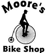 Logo for "Moore's Bike Shop," featuring a silhouette of a person riding a vintage penny-farthing bicycle. The text is bold and prominently displays the shop's name.