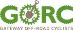 Logo of Gateway Off-Road Cyclists (GORC), featuring stylized text and a shovel intertwined with gears, emphasizing off-road cycling activities.