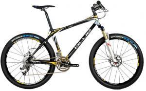 Blue XC Carbon: A sleek black and gold mountain bike with a lightweight frame, front suspension, and thick tires designed for rugged terrain. The bike features disc brakes and a modern design, showcasing its performance-oriented features.