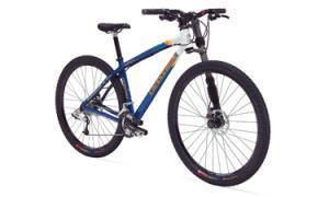 Cannondale Caffeine 29er: A blue mountain bike with a sturdy frame, wide tires, and front suspension, positioned on a white background.