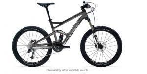Cannondale Jekyll Carbon 2: A sleek gray mountain bike featuring a sturdy frame, wide knobby tires, and a suspension system, designed for off-road use. The bike is depicted from the side, showcasing its geometric design and components.
