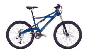 Cannondale Prophet 5: A blue mountain bike with a dual suspension frame, front disc brake, and knobby tires, positioned against a white background.