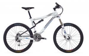 Cannondale Rize 4: A white mountain bike with a sleek design, featuring dual suspension, disc brakes, and thick tires suitable for off-road trails.