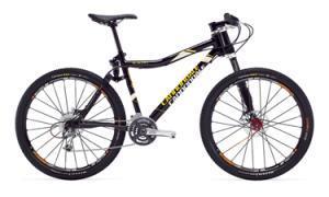 Cannondale Scalpel 1: Mountain bike with a black and yellow frame, featuring disc brakes and knobby tires, positioned against a white background.