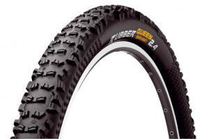 Continental Rubber Queen: A close-up view of a mountain bike tire with a knobby tread design, labeled "Zuger Queen" and sized 2.4. The tire has a black rubber surface with white sidewalls.