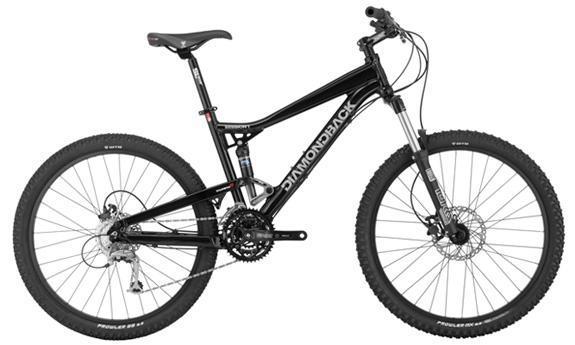 Diamondback Mission 1: A black Diamondback mountain bike featuring a dual suspension system, disc brakes, and knobby tires suitable for off-road terrains. The bike has a sleek design with a prominent brand logo visible on the frame.