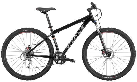 Diamondback Overdrive Pro: Black mountain bike with disc brakes, featuring a lightweight frame and thick tires, designed for off-road cycling.
