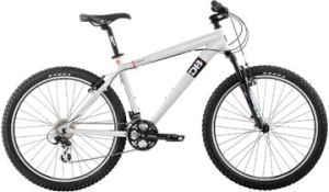 Diamondback Response: Mountain bike with a white frame, front suspension, and thick tires, positioned against a plain background.