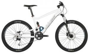 Diamondback Sortie 1: A white mountain bike with dual suspension, featuring black wheels and tires, a black seat, and handlebars. The bike is positioned against a plain background, showcasing its frame and components.