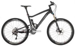 Diamondback Sortie Black: A sleek black mountain bike featuring front suspension, disc brakes, and a lightweight frame, positioned on a plain background.