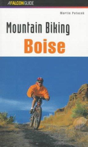 Falcon Guides Mountain Biking Boise: Cover of a book titled "Mountain Biking Boise" by Martin Pottock, featuring a mountain biker in an orange jacket riding along a trail with rocky terrain and a blue sky in the background.
