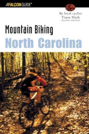 Falcon Guides Mountain Biking North Carolina: Cover of a guidebook titled "Mountain Biking North Carolina," featuring a cyclist riding on a dirt trail surrounded by trees. The book is authored by Timm Muth and is part of the Falcon Guide series.