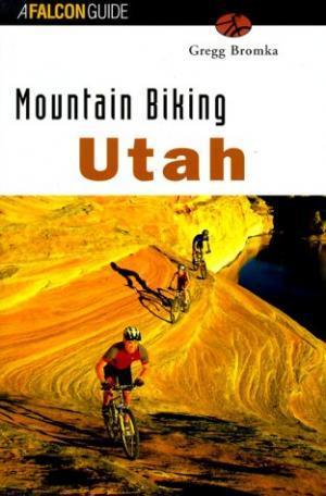 Falcon Guides Mountain Biking Utah: Cover of the book "Mountain Biking Utah" by Gregg Bromka, featuring two mountain bikers riding on colorful, textured terrain. The title is prominently displayed in bold black letters above the image, with a scenic landscape in the background.