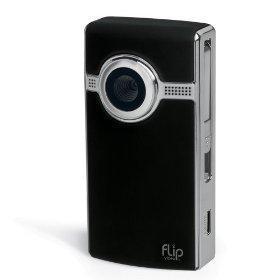 Flip UltraHD: A compact, black Flip video camera with a circular lens and chrome accents, designed for easy portability and casual video recording.