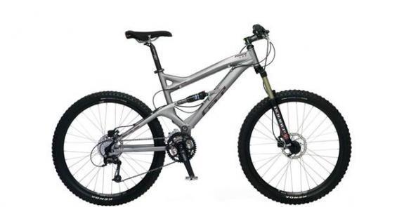 GT Force: A silver mountain bike with a suspension frame, featuring wide tires and front suspension forks, against a white background.