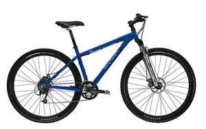 Gary Fisher Cobia: A blue mountain bike with a sturdy frame, front suspension, and disc brakes. The bike features knobby tires suitable for off-road terrain.