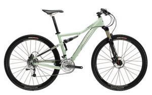 Gary Fisher HiFi Plus 29: A light green mountain bike with a sleek design, featuring dual suspension, disc brakes, and knobby tires, positioned on a plain background.