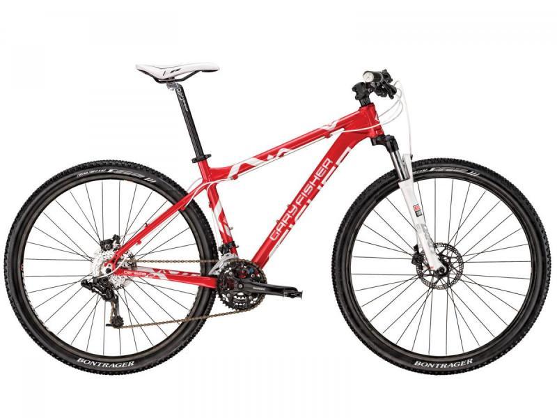 Gary Fisher Mamba: A red and white mountain bike with a lightweight frame, front suspension, and disc brakes. The bike features a modern design and mounted Bontrager tires.
