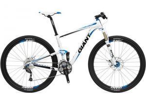 Giant Anthem X 29er 3: A white and blue mountain bike with the brand name "Giant" prominently displayed. The bike features a lightweight frame, front suspension, and disc brakes, designed for off-road cycling. The wheels have knobby tires suitable for rugged terrain.