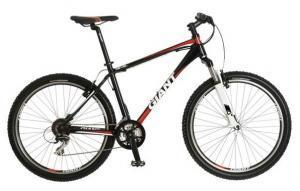 Giant Revel 2: A black and red mountain bike with a sturdy frame, equipped with wide tires and a front suspension fork. The bike features a comfortable padded seat and gear shifters on the handlebars.