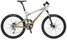 Giant Trance 2: A mountain bike featuring a lightweight aluminum frame with a combination of silver and gold colors, equipped with disc brakes, thick tires, and a front suspension fork.
