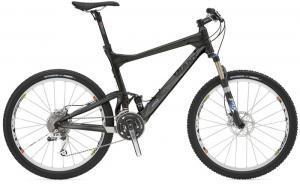 Giant Trance Advanced: A black mountain bike with a lightweight frame, front suspension, and disc brakes. The bike features a sleek design, with a prominent seat and handlebars, ideal for off-road cycling.