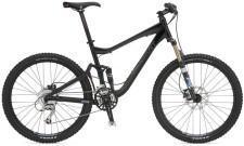 Giant Trance X2: A black mountain bike with a sturdy frame, front suspension, and wide tires, positioned upright against a neutral background.